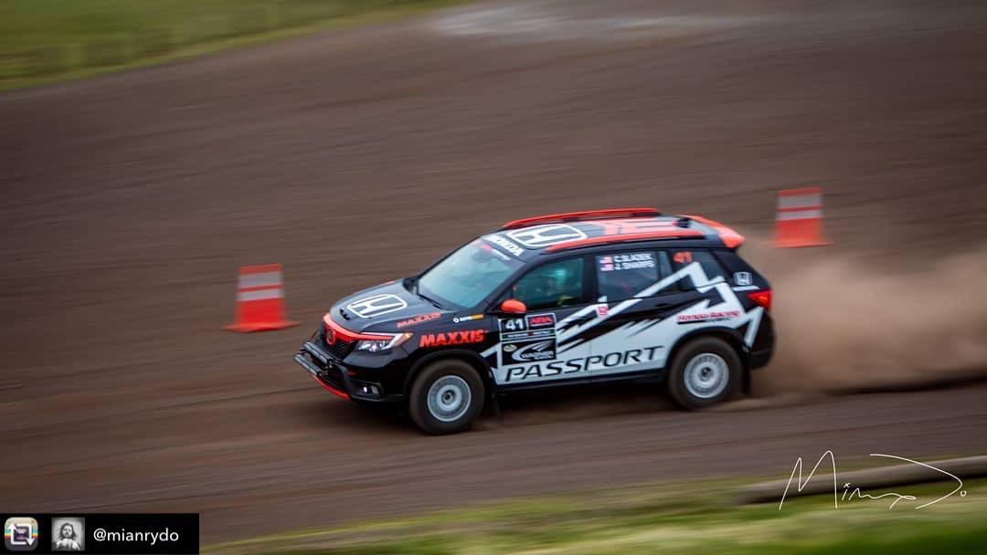Side view of Honda Passport rally vehicle graphics in motion.